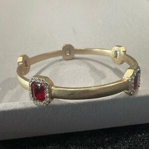 Gold-Tone Bangle Bracelet with Ruby-Colored Gem Accents
